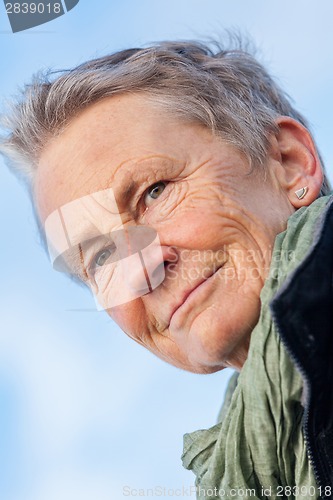 Image of happy grey-haired elderly woman senior outdoor