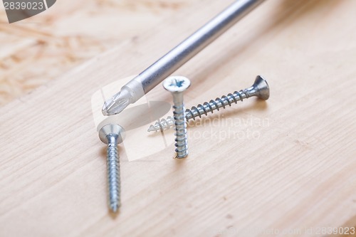 Image of Phillips head screwdriver and wood screws