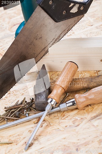 Image of Drill with timber, screwdrivers and screws