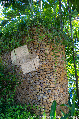 Image of Ornate column in formal Balinese garden
