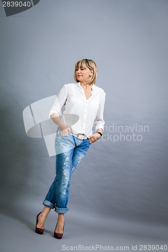 Image of Trendy middle-aged woman with a charming smile