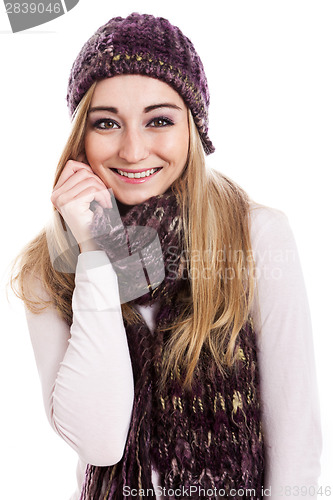 Image of Beautiful female model wearing beanie and scarf