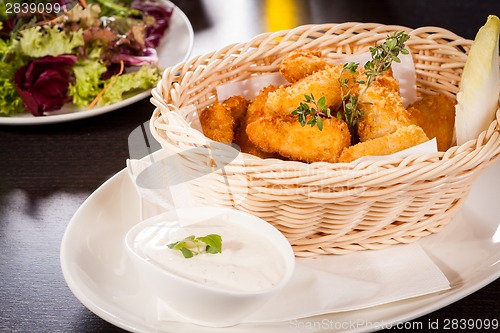 Image of Crumbed chicken nuggets in a basket