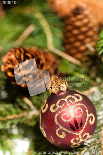 Image of Red Christmas balls with pine cones