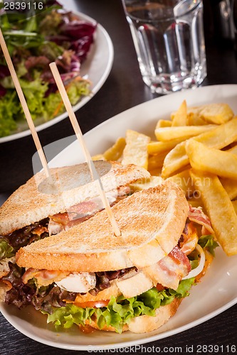 Image of Club sandwich with potato French fries