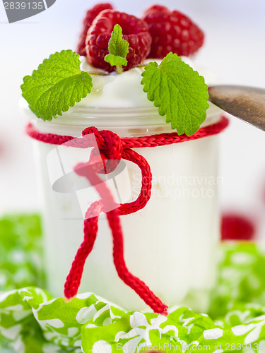 Image of Raspberries and yoghurt or clotted cream