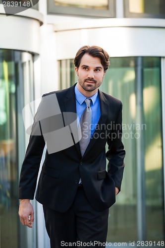 Image of Businessman standing waiting for someone