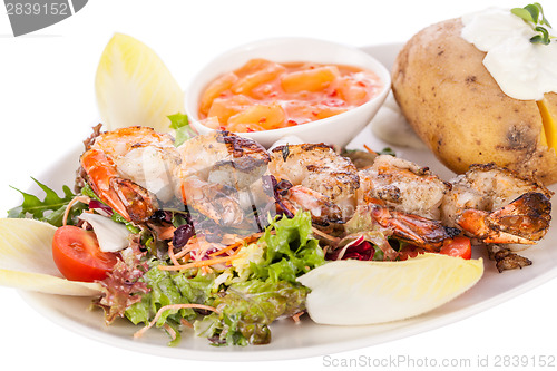 Image of Grilled prawns with endive salad and jacket potato