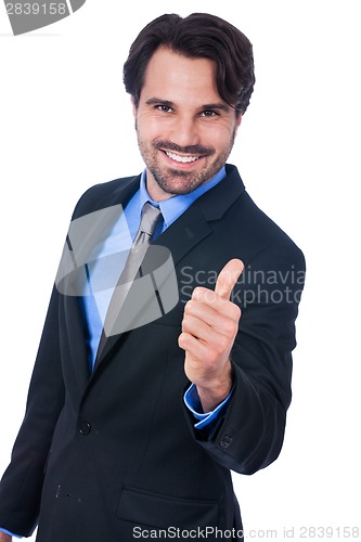 Image of Enthusiastic businessman giving a thumbs up