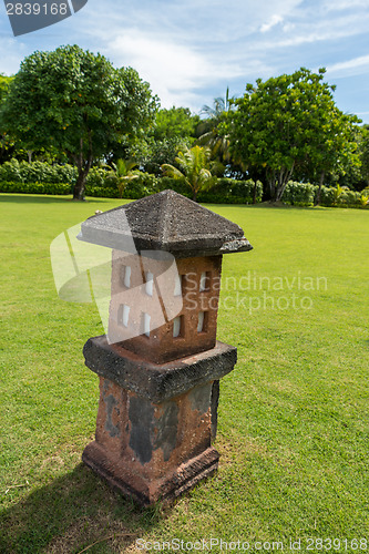 Image of Ornate column in formal Balinese garden