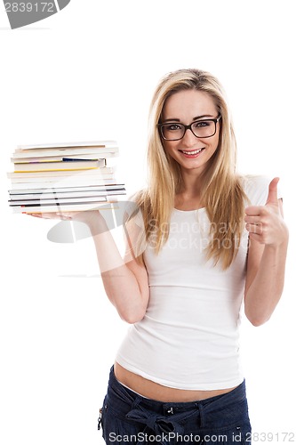 Image of Female model carrying books doing thumbs up sign