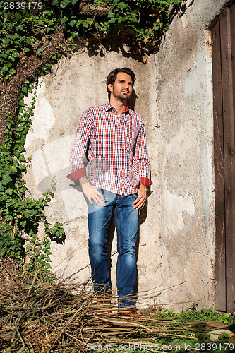 Image of Male model sitting with legs crossed