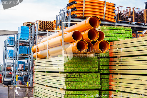 Image of Several pipes stacked in yard