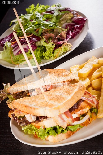 Image of Club sandwich with potato French fries