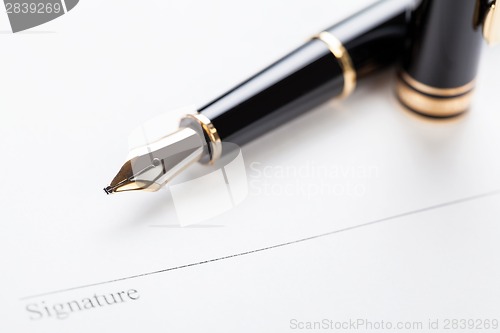 Image of macro closeup sign document contract pen filler 