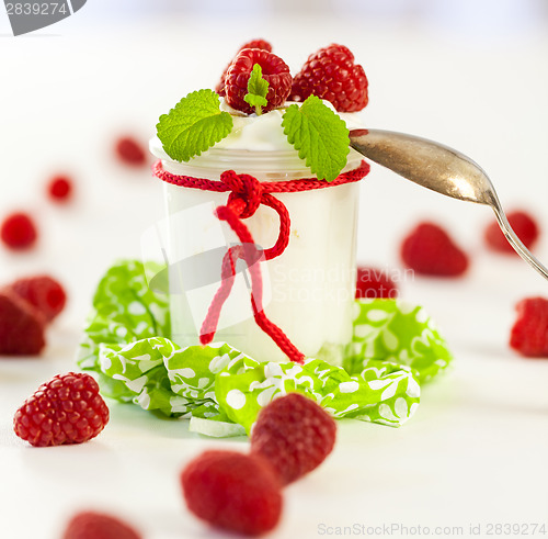 Image of Raspberries and yoghurt or clotted cream