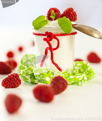 Image of Raspberries and yoghurt or clotted cream