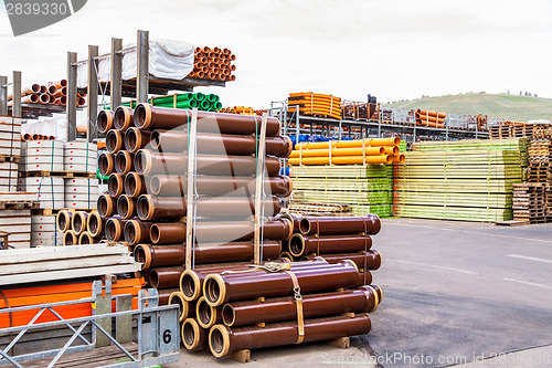 Image of Several pipes stacked in yard
