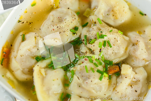 Image of Dish of savory pork tortellini in broth pelmeni russian