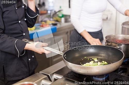 Image of Chef or braising meat in a frying pan