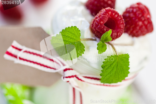 Image of Raspberries and yoghurt or clotted cream