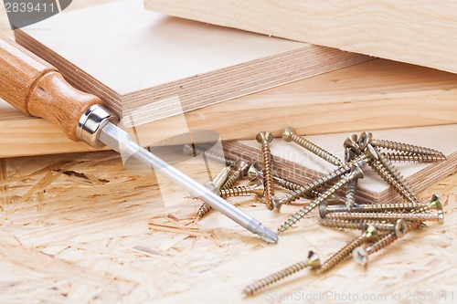 Image of Phillips head screwdriver and wood screws