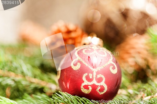 Image of Red Christmas balls with pine cones