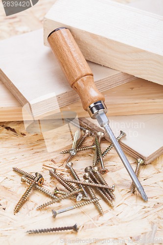 Image of Phillips head screwdriver and wood screws