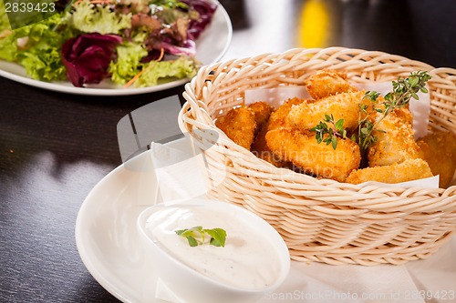 Image of Crumbed chicken nuggets in a basket