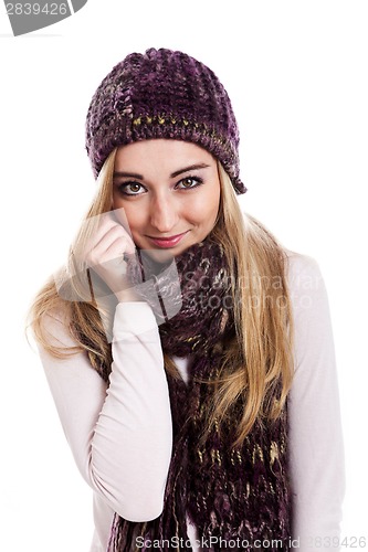 Image of Beautiful female model wearing beanie and scarf