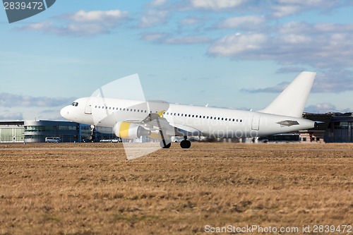 Image of Passenger airliner taking off at an airport