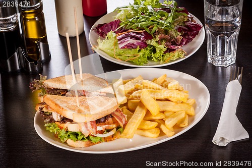 Image of Club sandwich with potato French fries