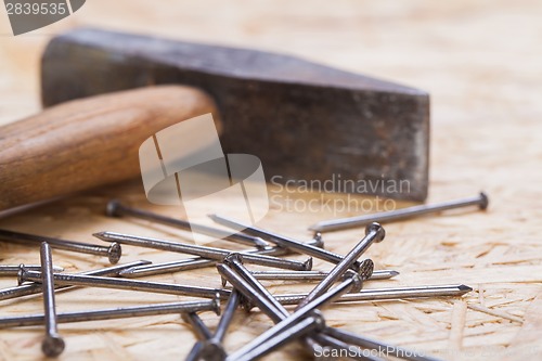 Image of Mallet with nails and planks of new wood