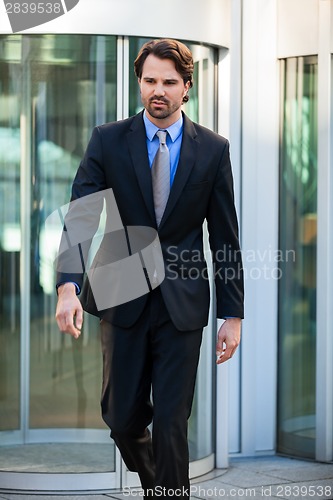 Image of Businessman standing waiting for someone