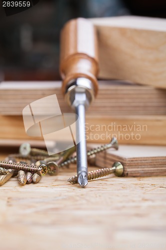 Image of Phillips head screwdriver and wood screws