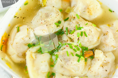 Image of Dish of savory pork tortellini in broth pelmeni russian