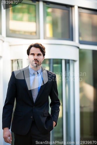 Image of Businessman standing waiting for someone