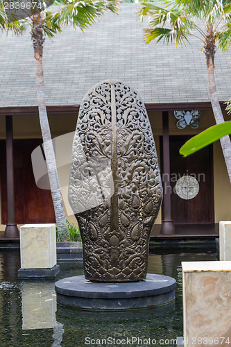 Image of Ornate column in formal Balinese garden