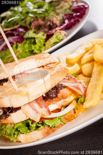 Image of Club sandwich with potato French fries