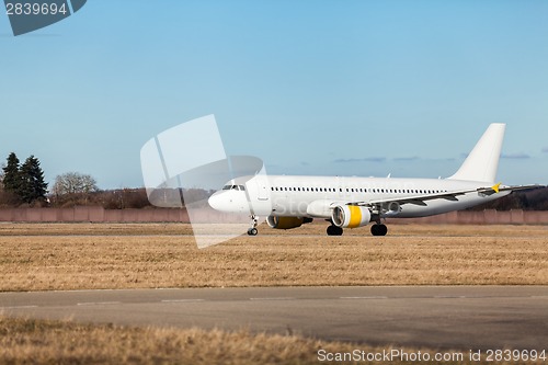 Image of Passenger airliner taking off at an airport