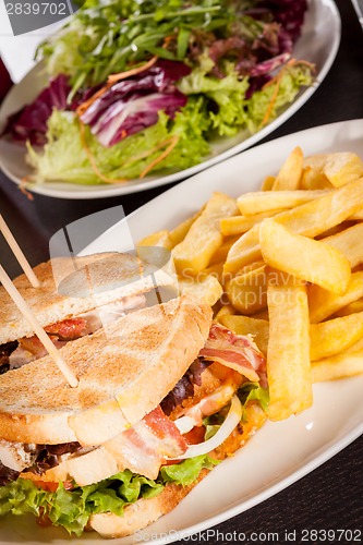 Image of Club sandwich with potato French fries