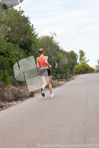 Image of Fit young woman jogging