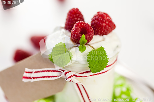 Image of Raspberries and yoghurt or clotted cream