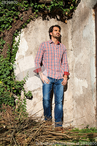 Image of Male model sitting with legs crossed