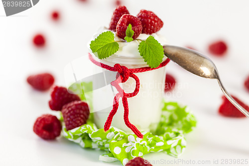 Image of Raspberries and yoghurt or clotted cream