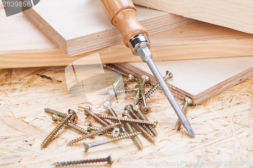 Image of Phillips head screwdriver and wood screws