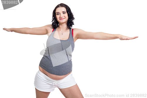 Image of Pregnant woman doing aerobics exercises