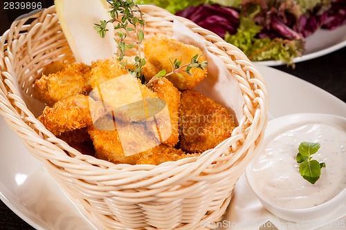 Image of Crumbed chicken nuggets in a basket