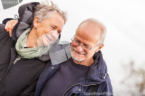 Image of happy mature couple relaxing baltic sea dunes 