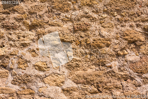 Image of Old Wall Constructed Of Stone Bricks.